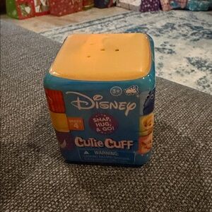 Disney Cutie Cuff Snap Hug & Go Toy - Blue and Yellow